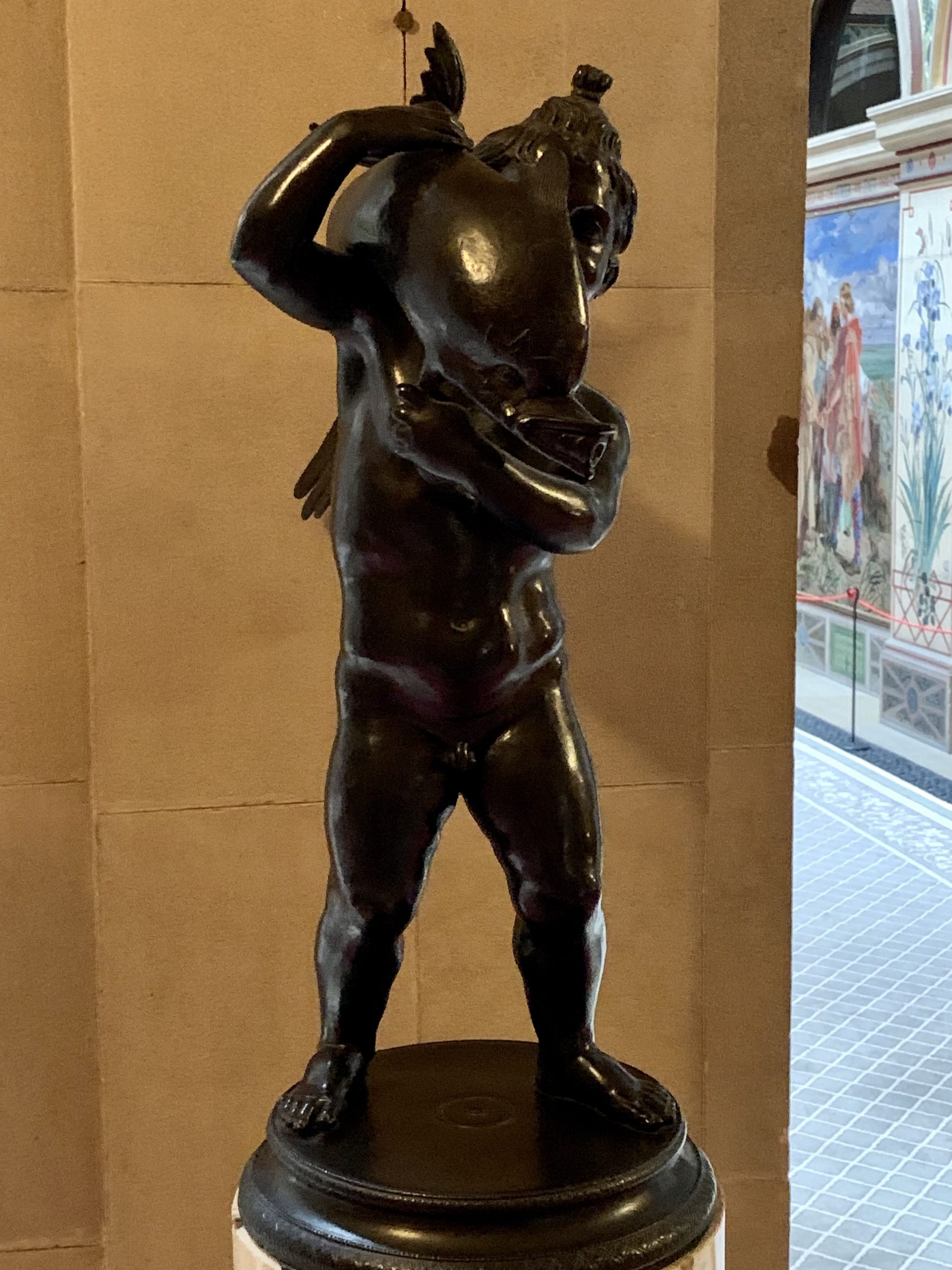 Cherub holding a Dolphin